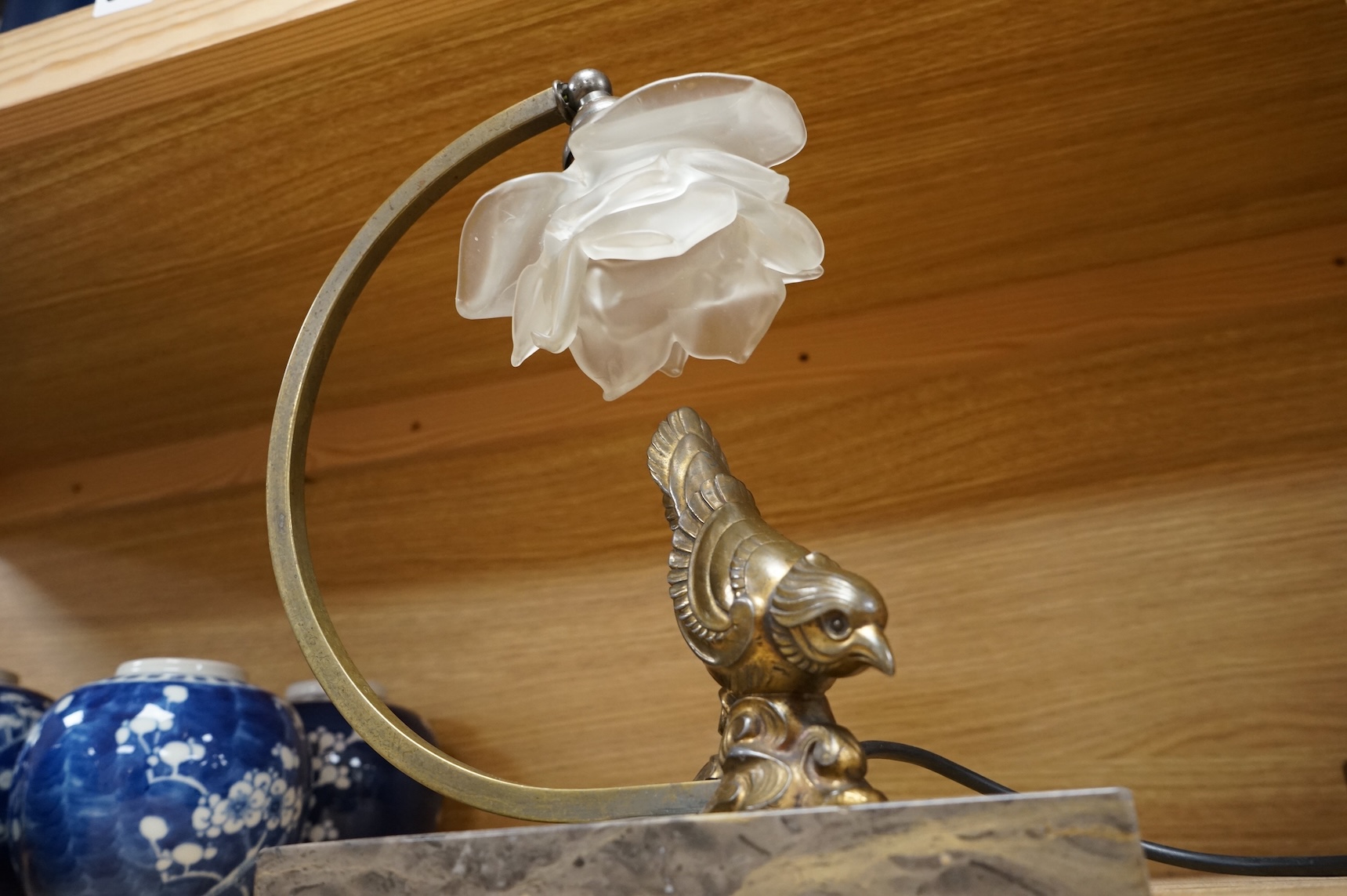 An Art Deco table lamp in the form of a bird with tchecoslovaquie glass shade, 26cm high